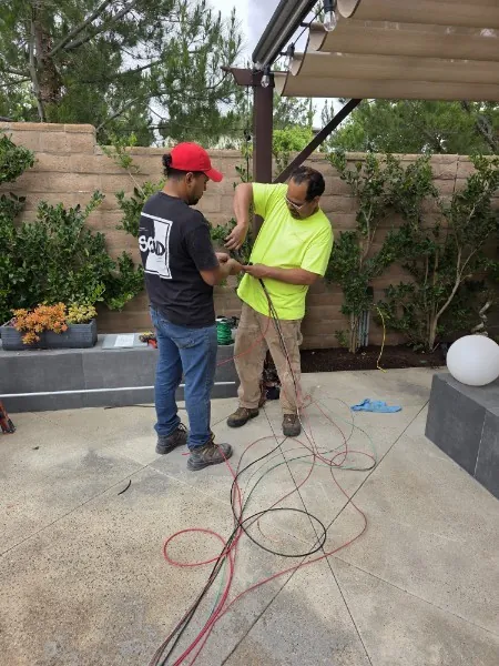 Electrician installing commercial electrical panel